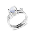 S925 silver geometric ring with irregular triangle shape and central moonstone on a model's hand.