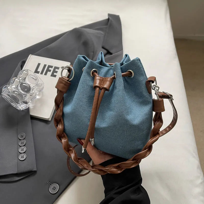 Blue synthetic leather one-shoulder cross-body bucket bag with optional hanging ornaments
