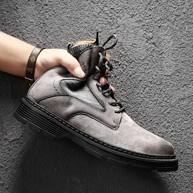 Men's vintage Martin boots in black with a round toe and low thick heel on a rubber sole.