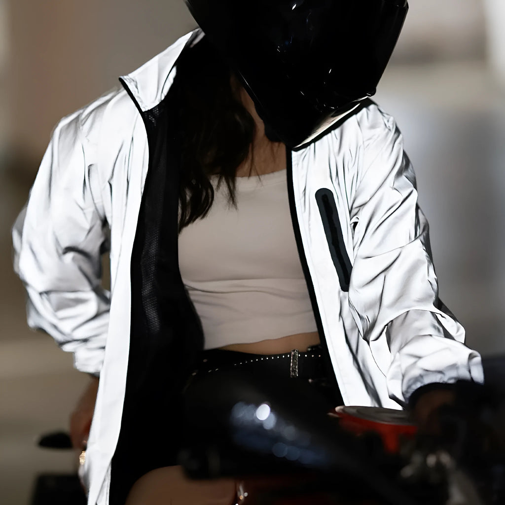 Silver waterproof polyester long sleeved outdoor coat showing windproof features across six European sizes
