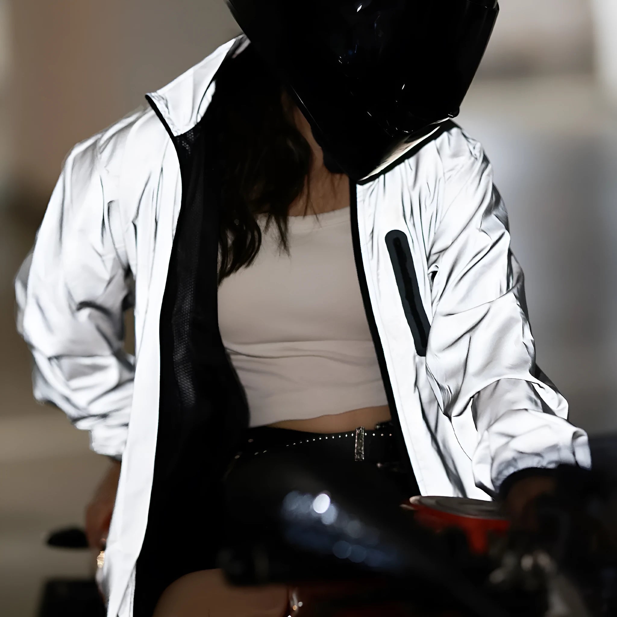 Silver waterproof polyester long sleeved outdoor coat showing windproof features across six European sizes