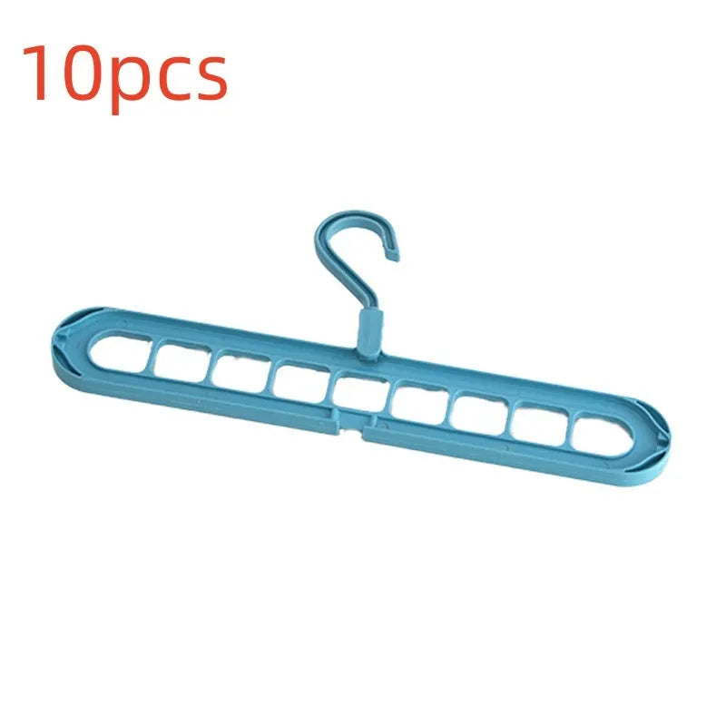 Green plastic nine-hole folding hanger for trousers displayed open and folded flat.