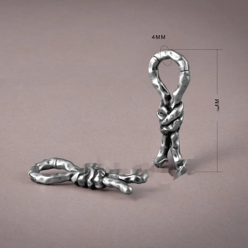 Close-up of a copper bending and connecting earring for cartilage piercing, 4mm in size.