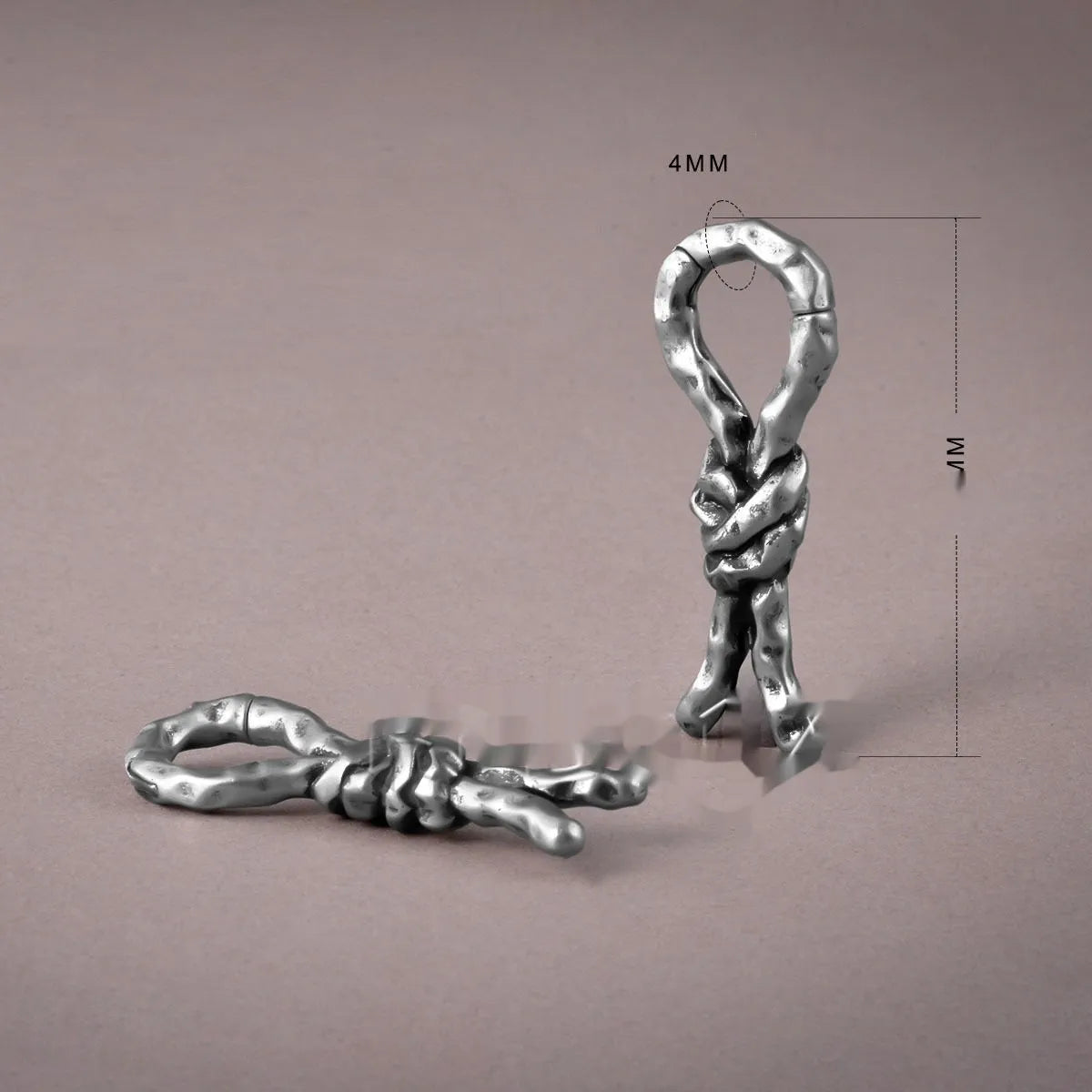 Close-up of a copper bending and connecting earring for cartilage piercing, 4mm in size.