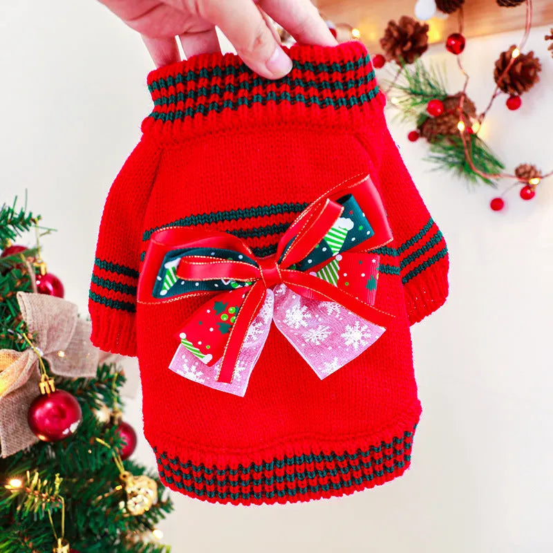 Red polyester Christmas dog jumper on small dog showing festive patterns and pullover design