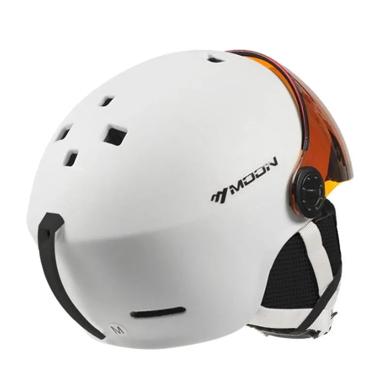 Moon ski helmet in black with polycarbonate shell and retractable visor on white background