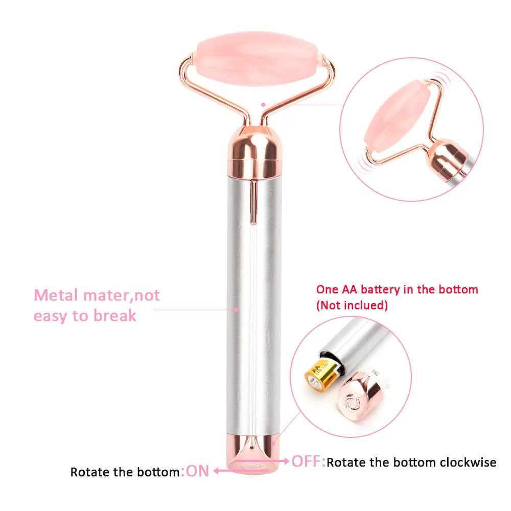 Electric vibrating rose quartz facial roller with under eye press on pink background