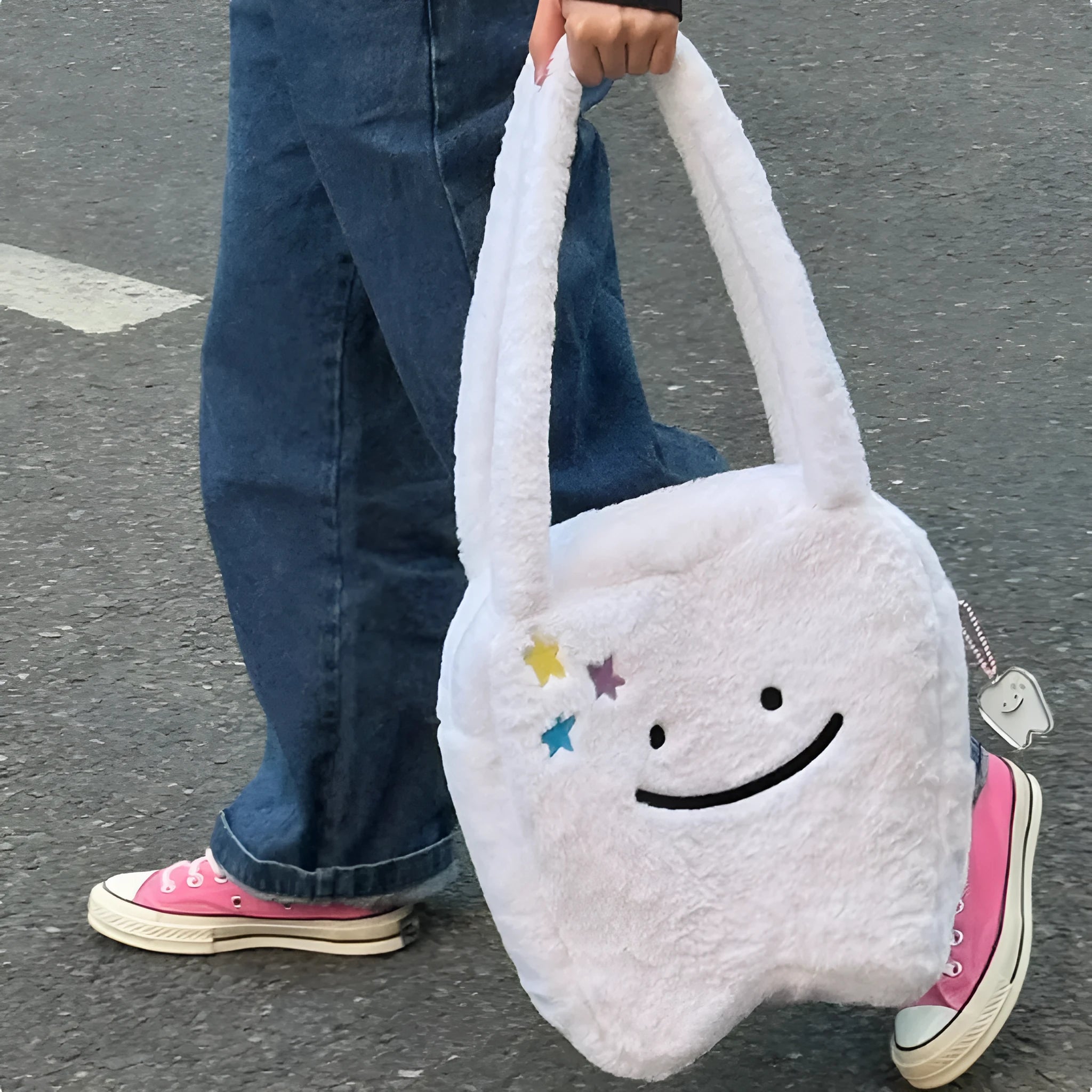 White plush shoulder tote bag with large tooth pattern decoration and zipper closure