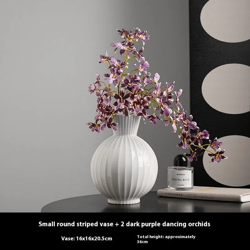 White ceramic ball vase with striped patterning in American country style on wooden table