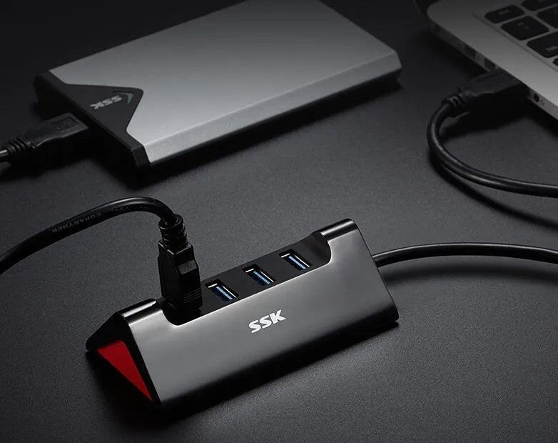 Black USB computer expansion dock with multiple USB ports and compact ABS plastic construction