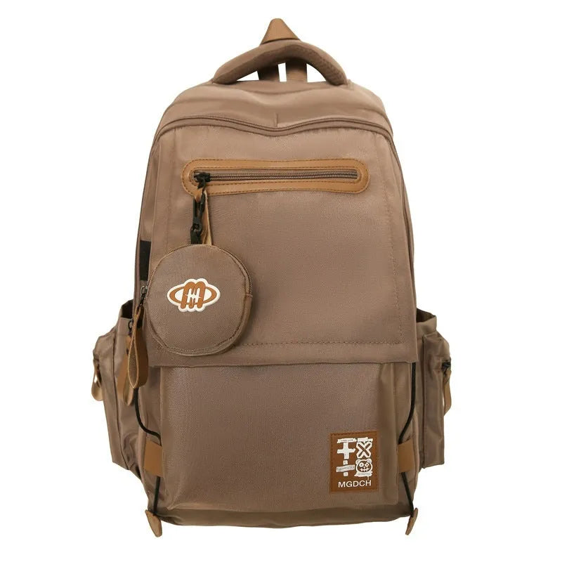 Large capacity nylon backpack for middle school students with curved shoulder straps in multiple colour options
