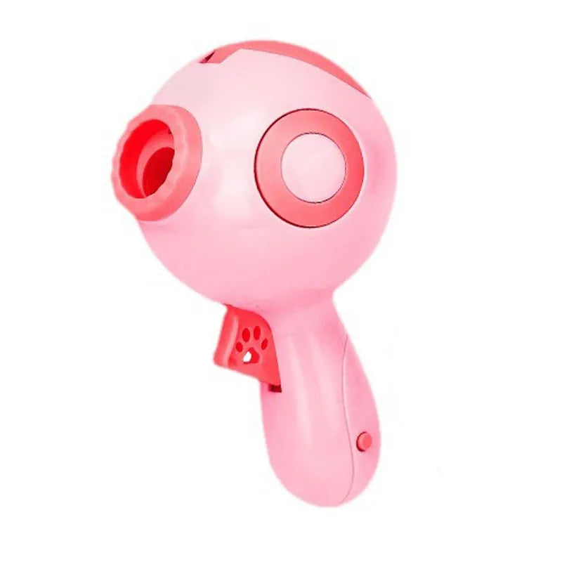Green, orange, and pink dog treat launcher toy shown next to a measuring tape indicating 15.5 cm length.