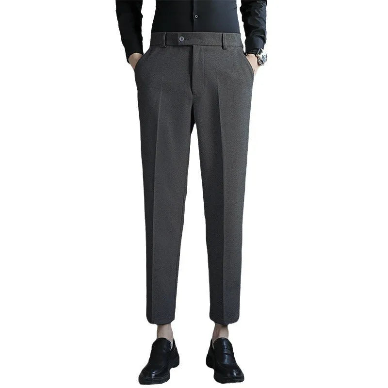 Retro brown straight leg corduroy trousers with elastic waistband laid flat.