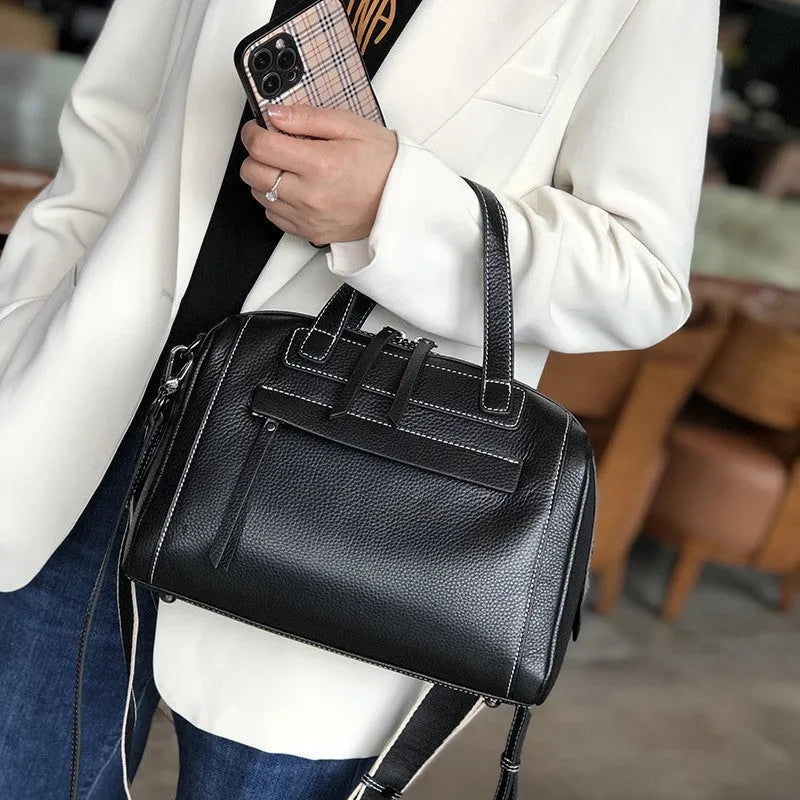 Genuine leather messenger bag with Boston lychee pattern stitching showing horizontal square shape and shoulder strap