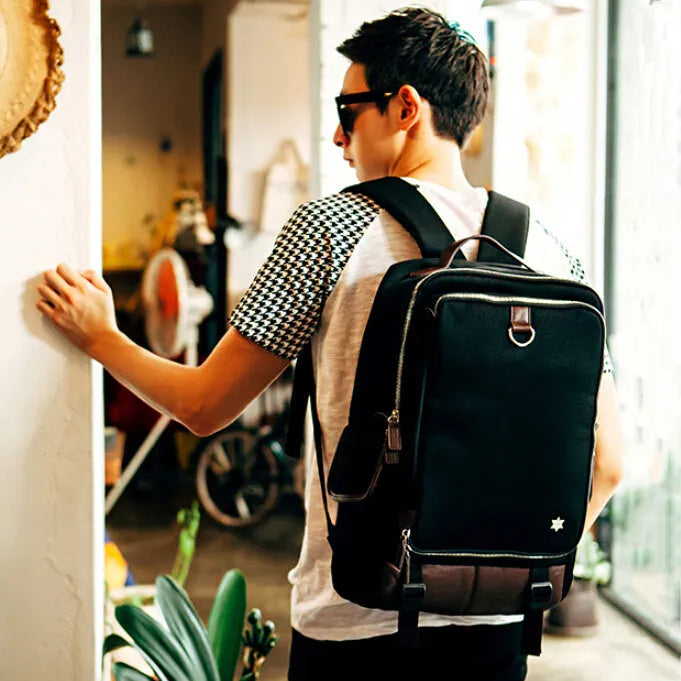 Modern men's backpack in Oxford cloth showing large main compartment, available in army green colour.