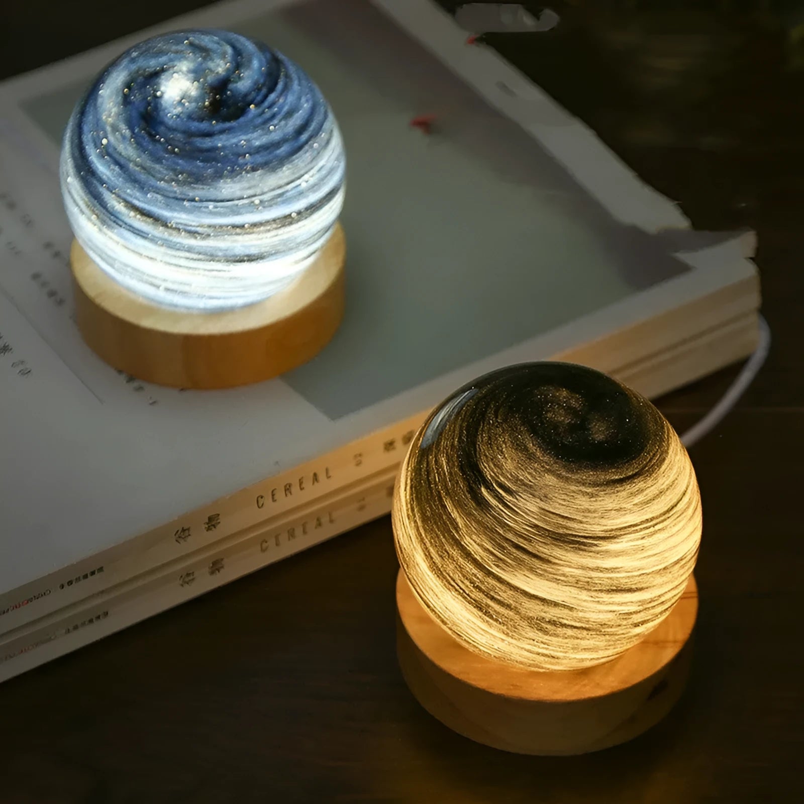 Planet night light with USB cable and base in modern simple design showing spherical shape