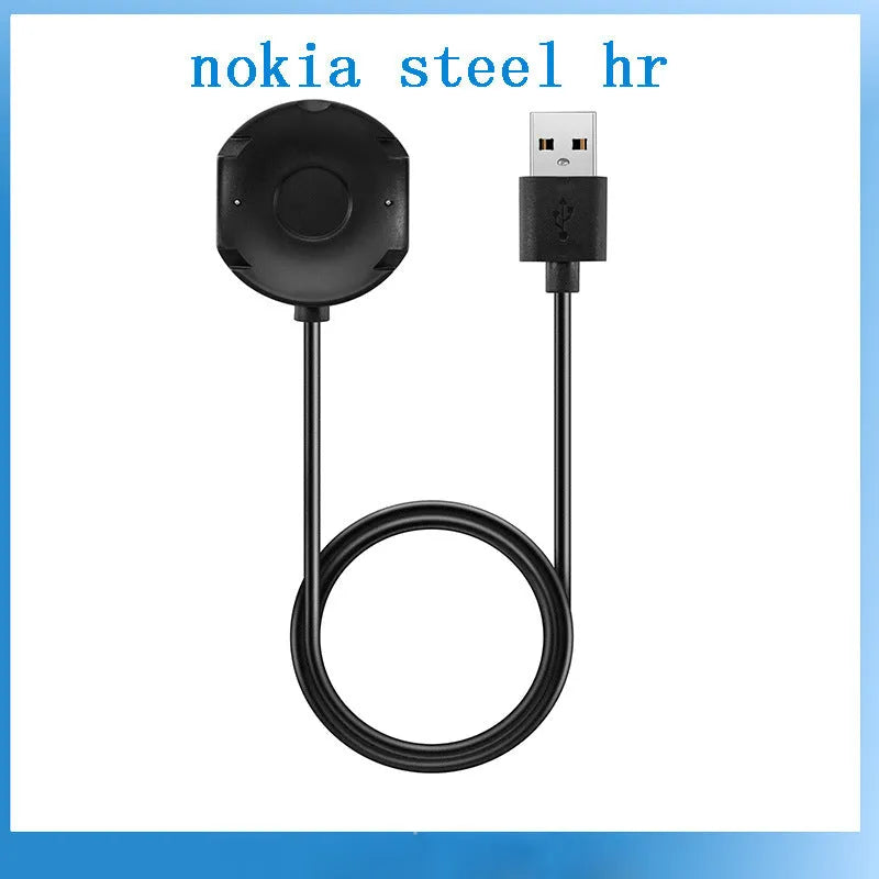 Black Withings Hybrid Smart Watch charging cable with magnetic probe on a desk