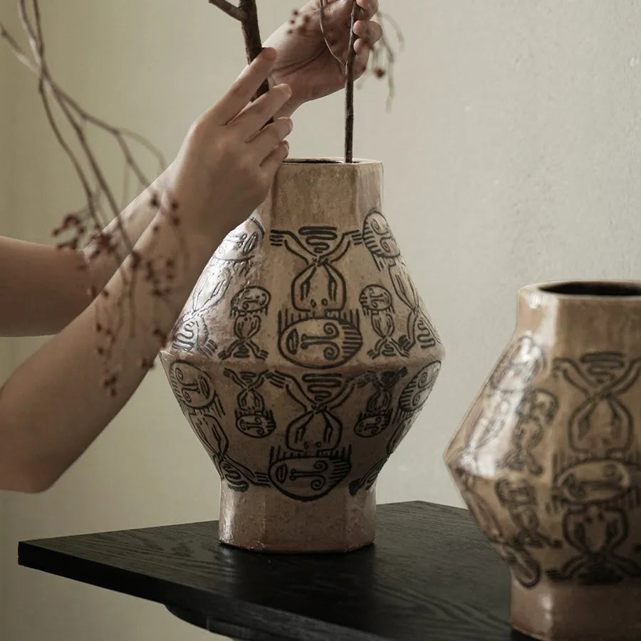 Hand-painted ceramic cylindrical vase with carved tribal totem vintage design.