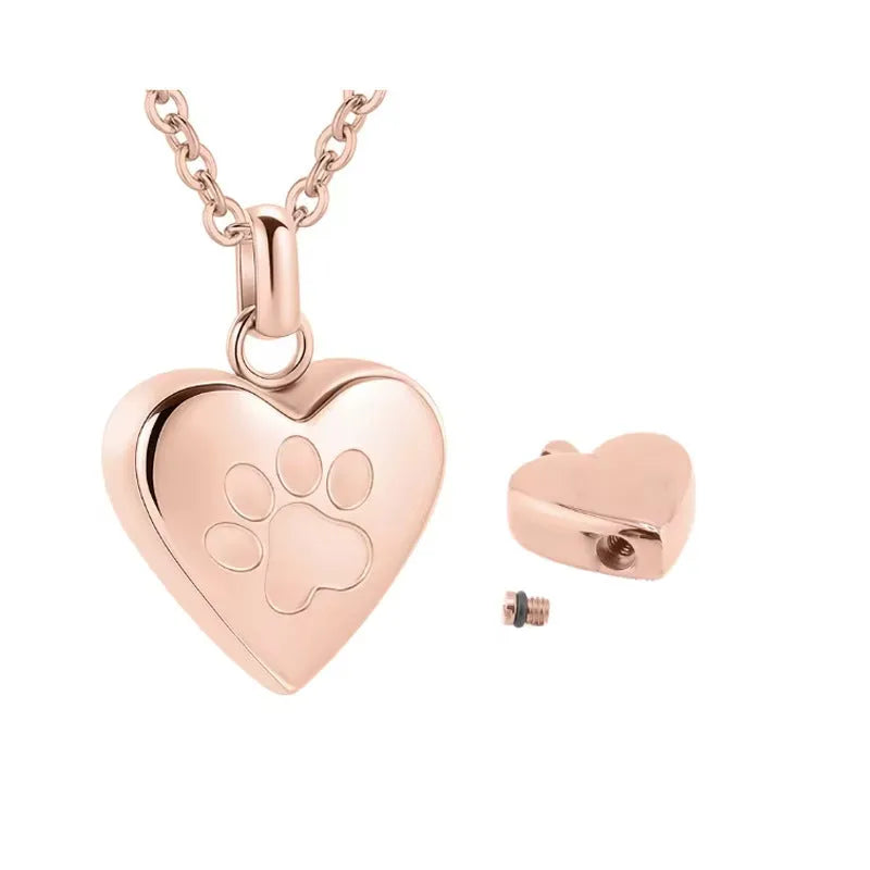 Openable heart-shaped cinerary casket necklace with paw print, made from polished titanium steel.