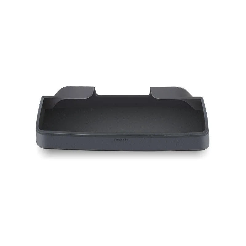 Black silicone glasses case mounted on a Tesla Model 3 or Y central armrest.