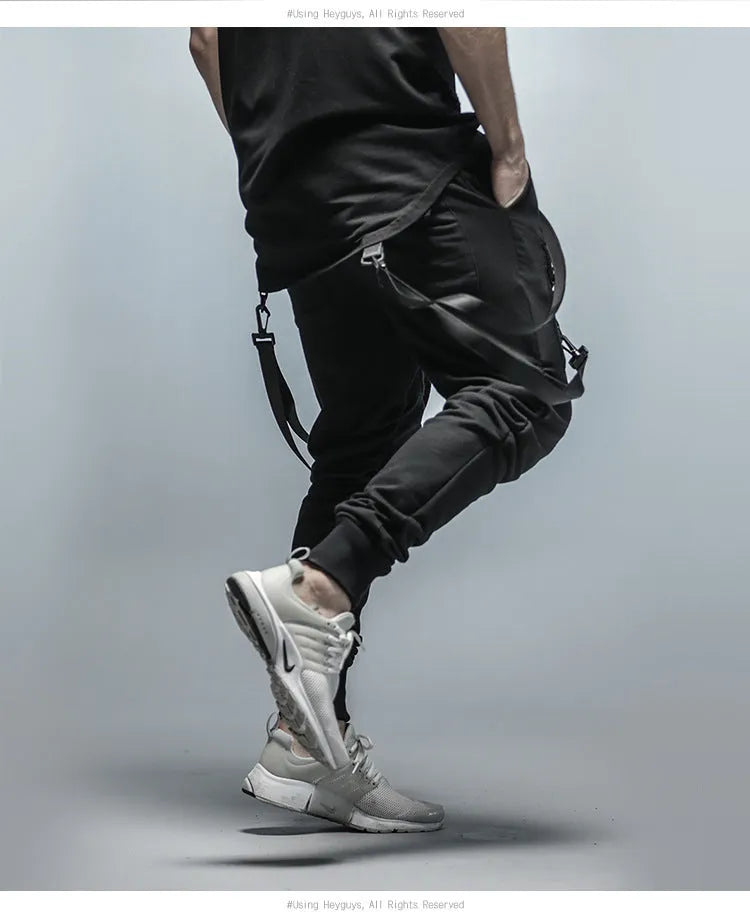 Black cotton blend men's hip hop pencil sweatpants with belt lying flat