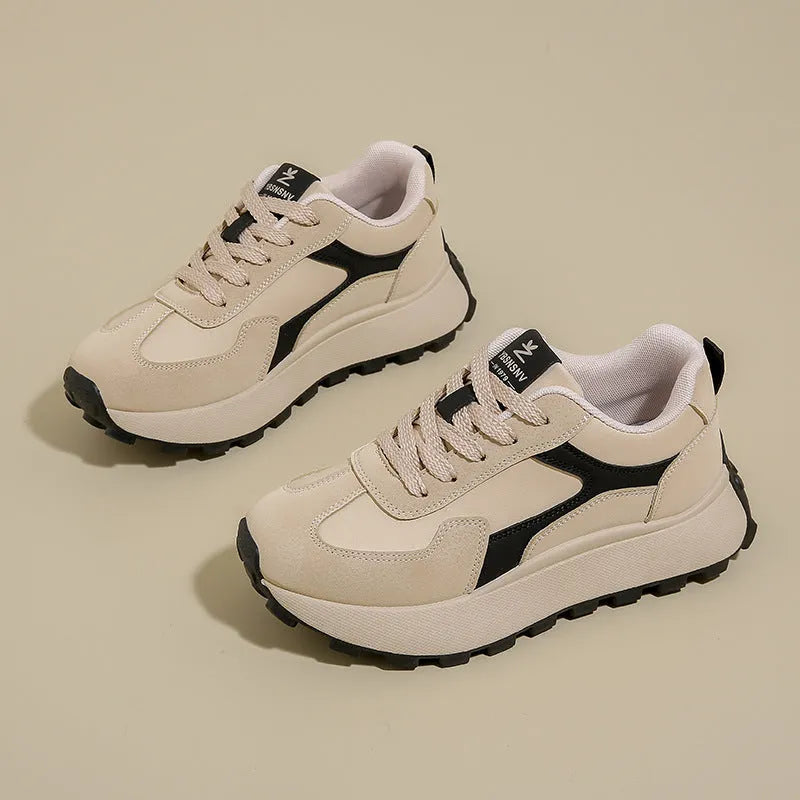 Women's low-top platform running shoes in black, red, or grey with lace-up front and flat rubber sole.
