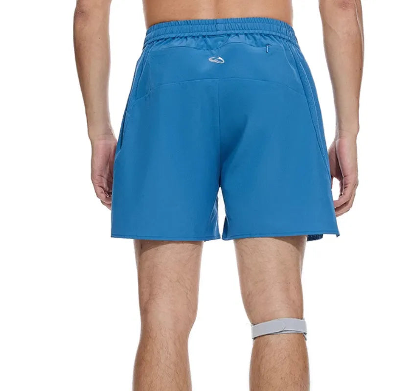 Black and blue four-point running shorts with laser punching stitching details on a mannequin.