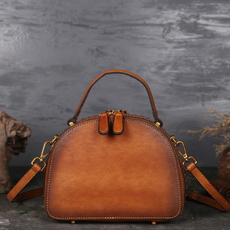 Vintage-style suede cowhide leather handbag with multiple internal organisation pockets.
