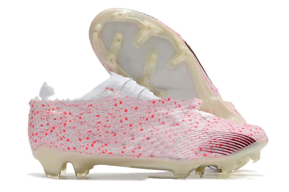 Men's knitted blue and white football shoes with FG studs and a lace-up front.