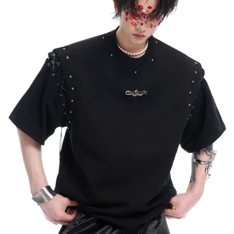 Short sleeve black top with a white lace-up cutout detail on the front, deconstruction style.