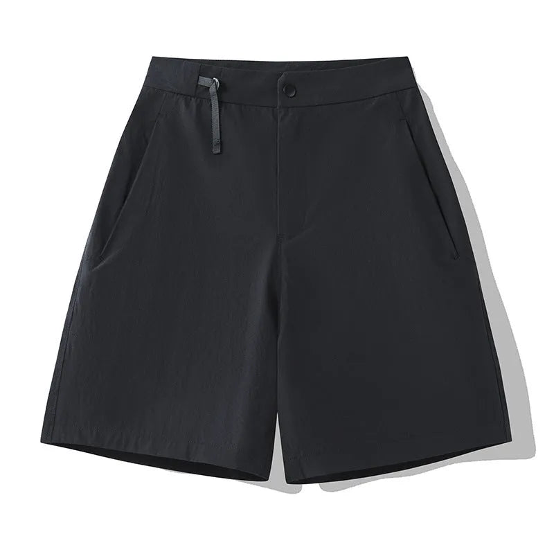 Men's solid colour quick-drying sports shorts with elastic construction, shown in khaki colour
