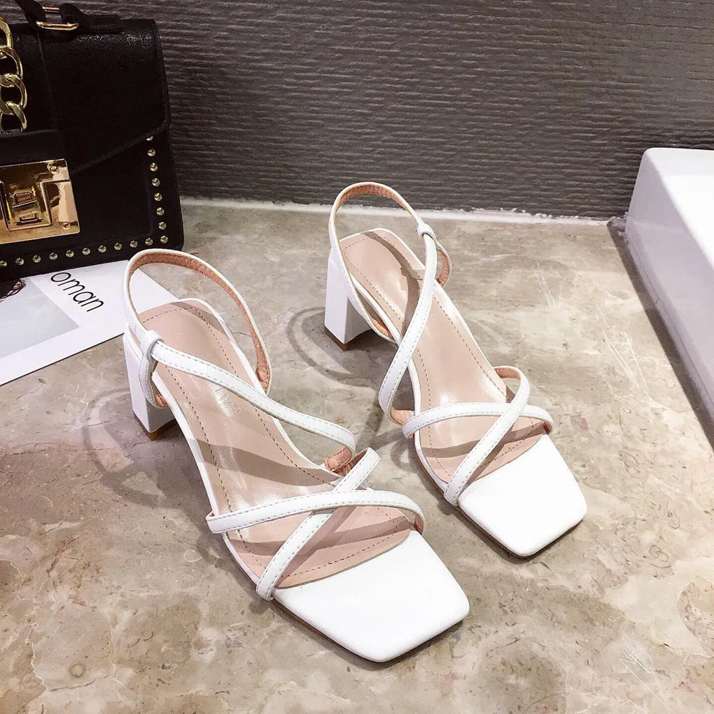 Women's white thick heel Roman sandals with a super high heel and sleeve style fit.