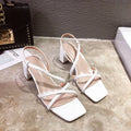 Women's white thick heel Roman sandals with a super high heel and sleeve style fit.