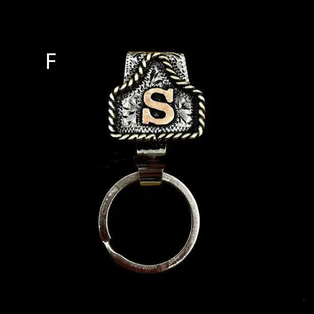 Handmade metal keychain with a cow tag charm in one of 26 available colour options.