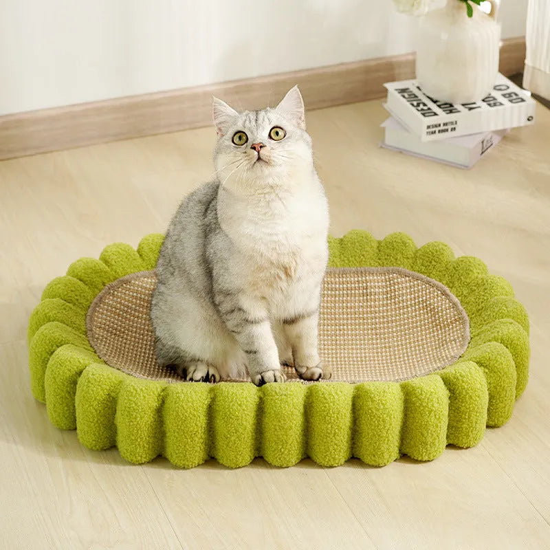 Green oval cat scratcher bed made from sisal, showing its bowl shape and textured scratching surface.