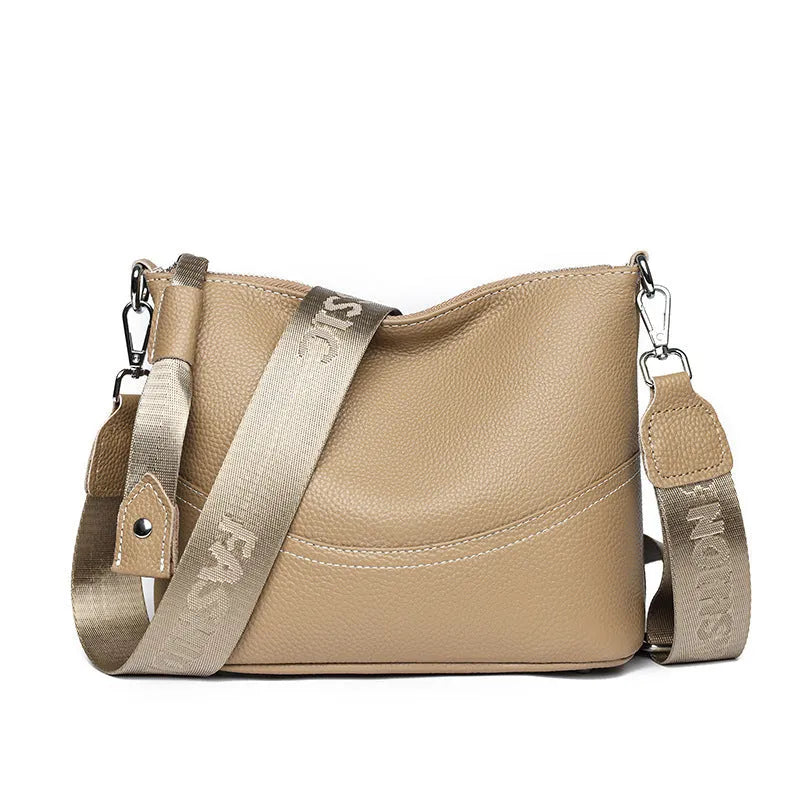 Genuine leather crossbody bag in black with spliced design and multiple internal pockets