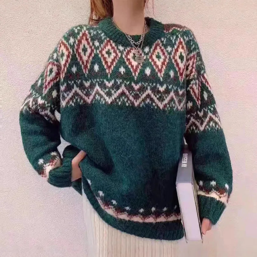 Red and white striped loose retro-style long sleeve pullover knitted top on a hanger.
