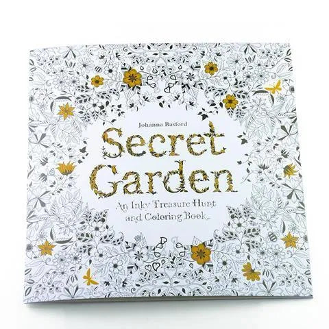 Adult DIY colouring book Secret Garden model open to a detailed black and white cartoon illustration page.