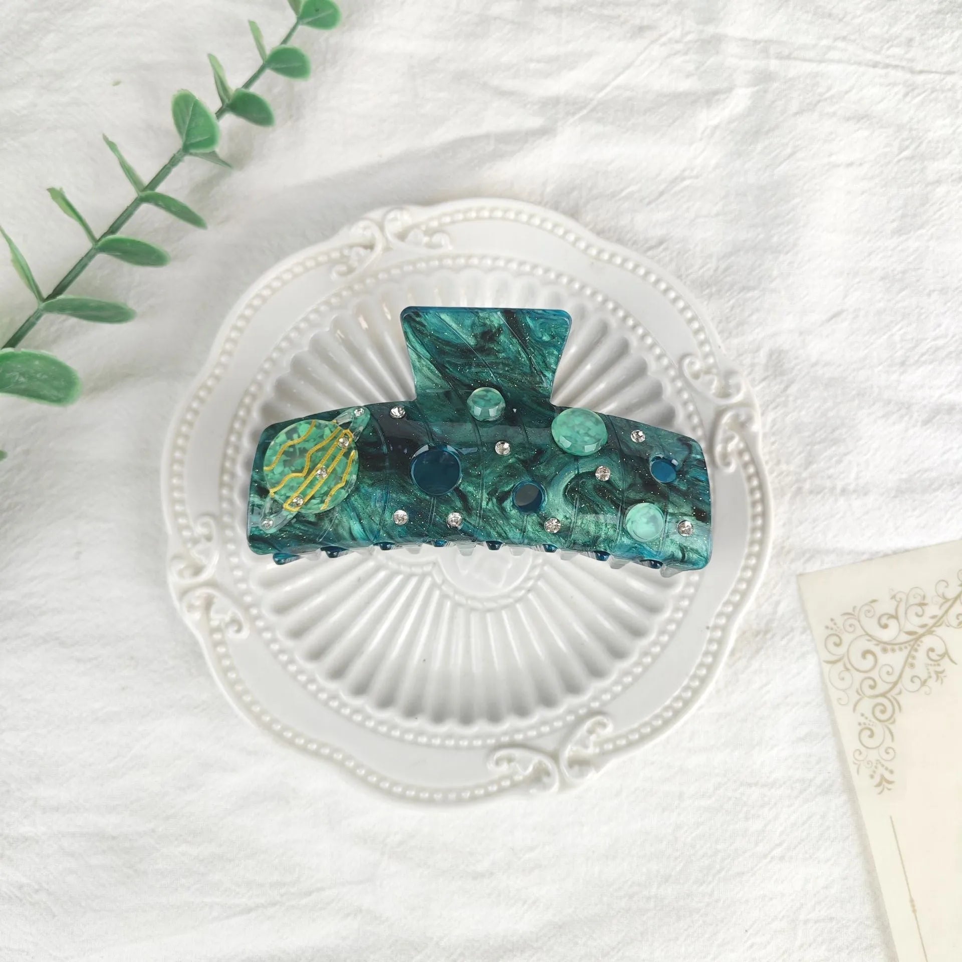 Oversized women's barrette with star moon starry sky pattern in sky blue colour.
