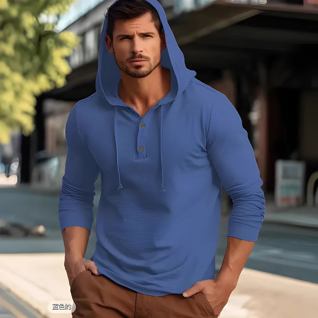 Men's dark blue cotton pullover hoodie with long sleeves on a hanger.