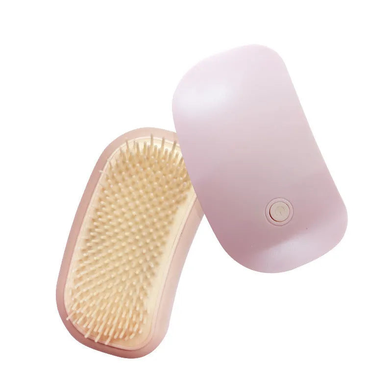 Light pink and white handheld electric pet massage brush with TPE teeth