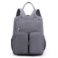 Women's waterproof nylon travel backpack with multiple internal compartments in various colours