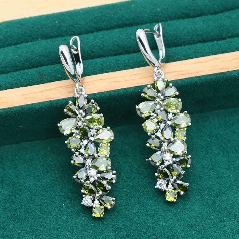 Retro floral pattern jewellery set with necklace, earrings, ring, and bracelet in olive or purple colours