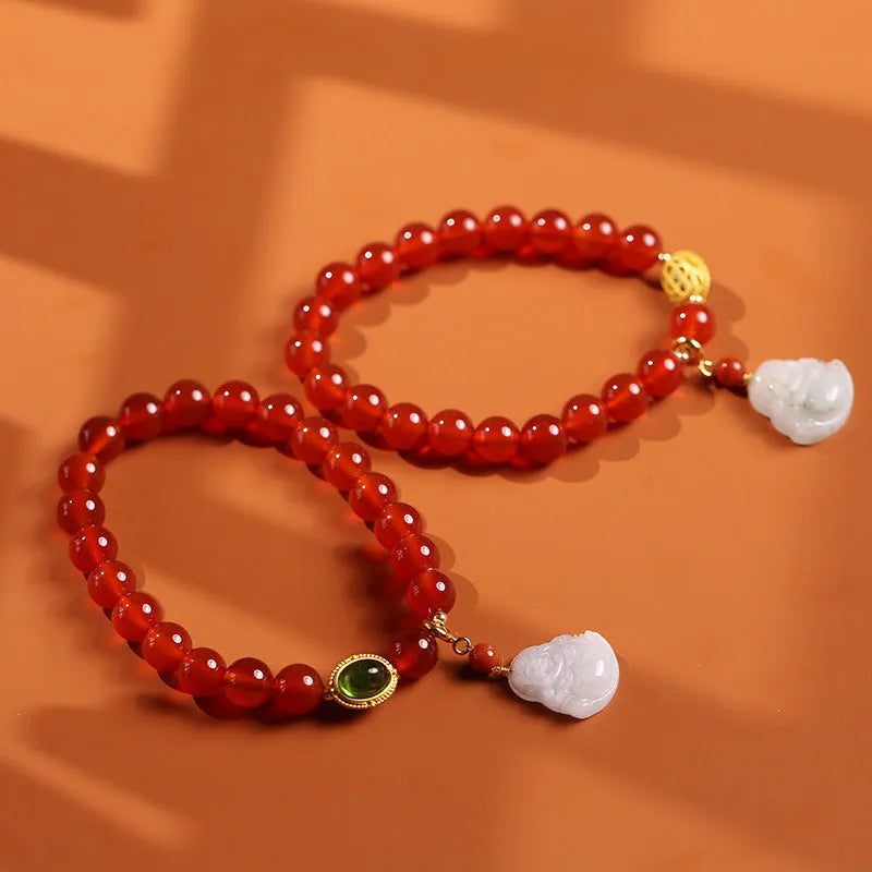Women's handcrafted amber bracelet with red agate stones and gold Maitreya Buddha jade pendant
