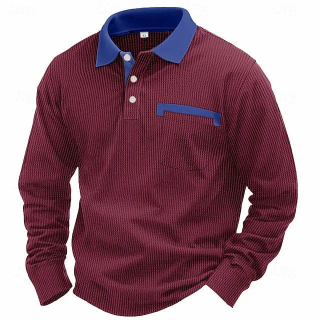 Man wearing a long-sleeved waffle knit polo shirt in a solid colour with an asymmetric design detail.