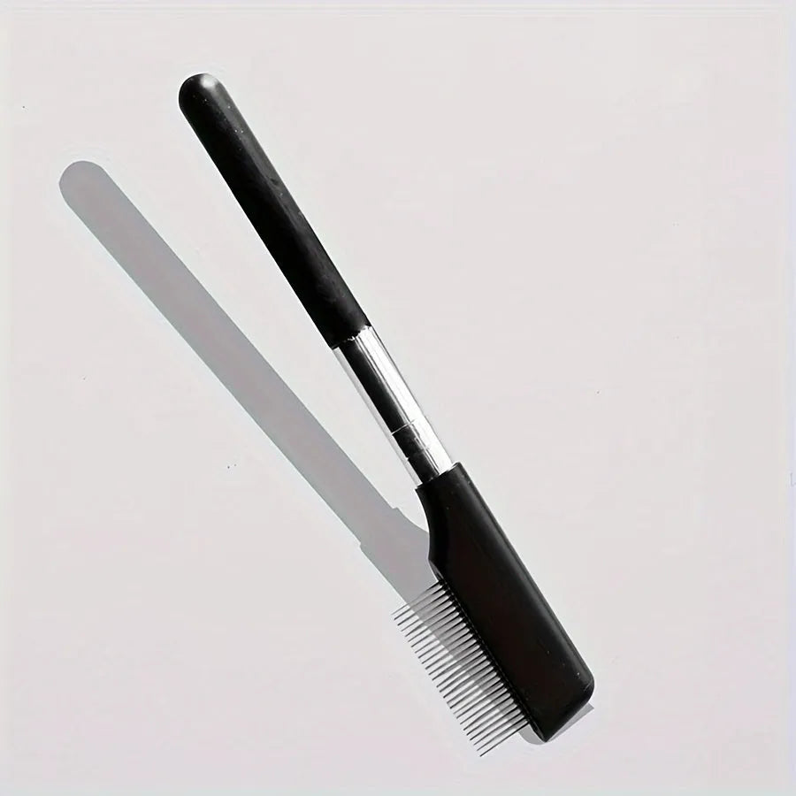 Black ambidextrous pet grooming brush with soft bristles and a comb for dogs and cats.