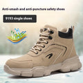 Brown leather steel toe cap safety work boots with a rubber sole on a work site background.