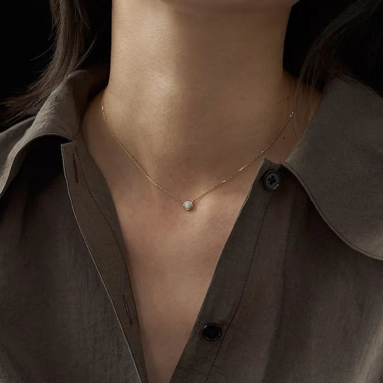 Geometric oval jelly opal pendant necklace in S925 silver with gold or white gold plating.