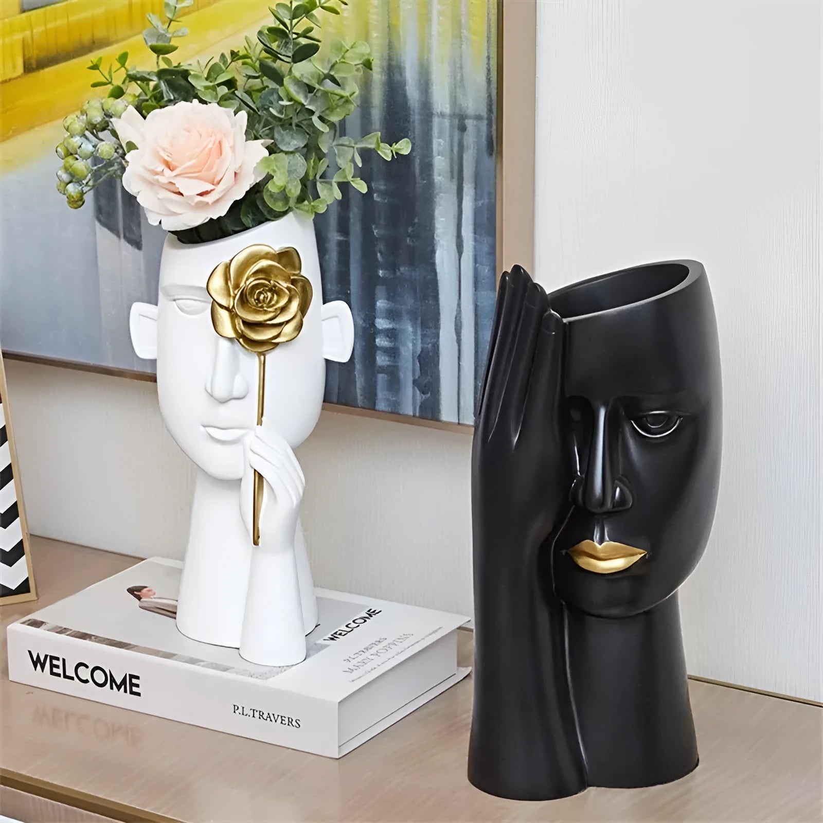 Modern black and white resin vase with sculpted body shape on living room table