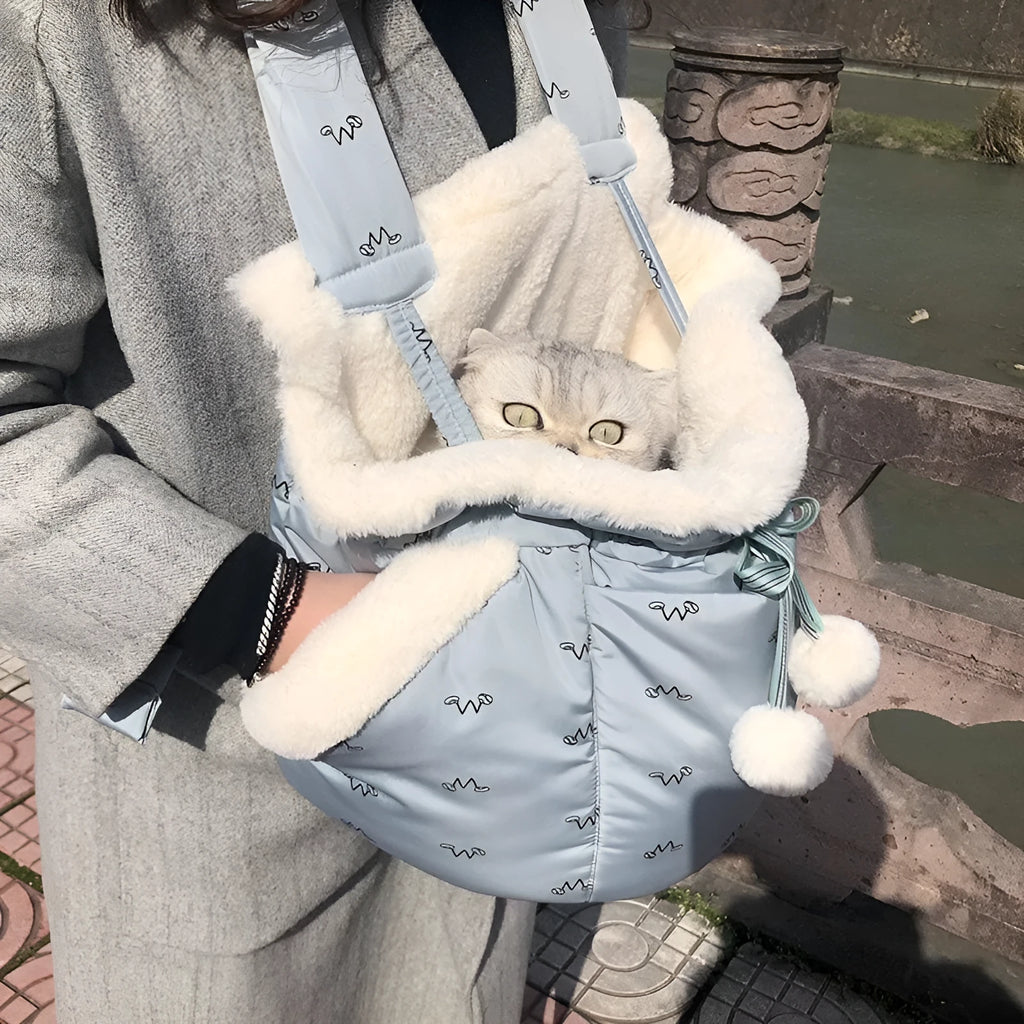 Blue winter pet carrier backpack made of plush flannel for outdoor travel with small cats and dogs